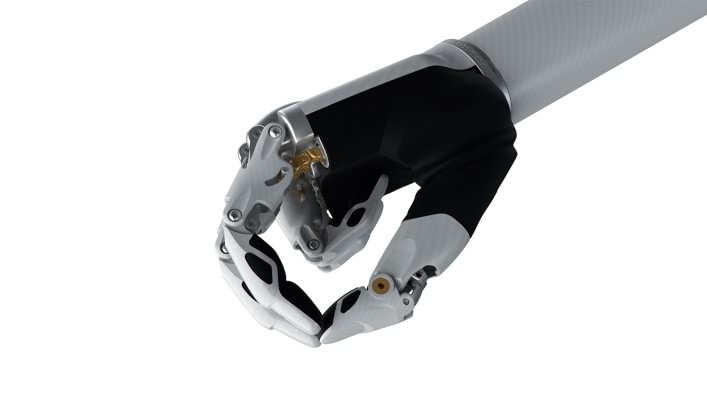 Image of the bebionic hand small in white in the tripod grip.