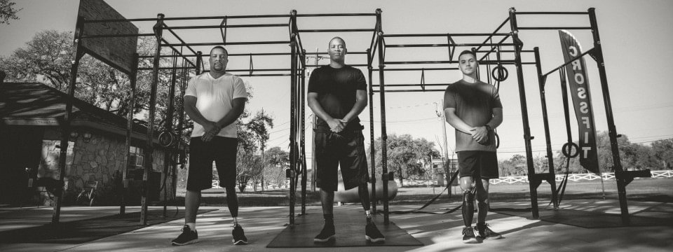 three veterans at an outdoor gym, all wearing x3 microprocessor knees