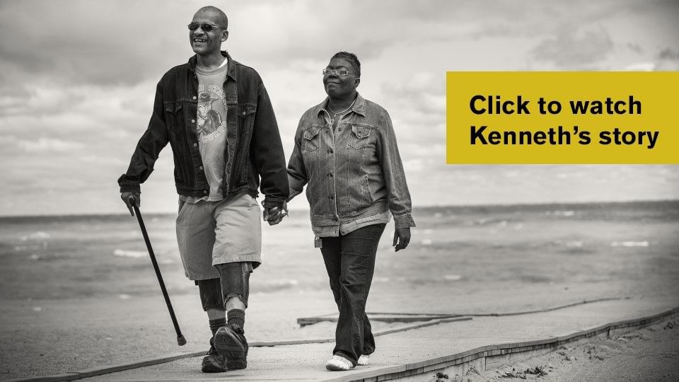 Kenneth walking with wife using C-Braces.